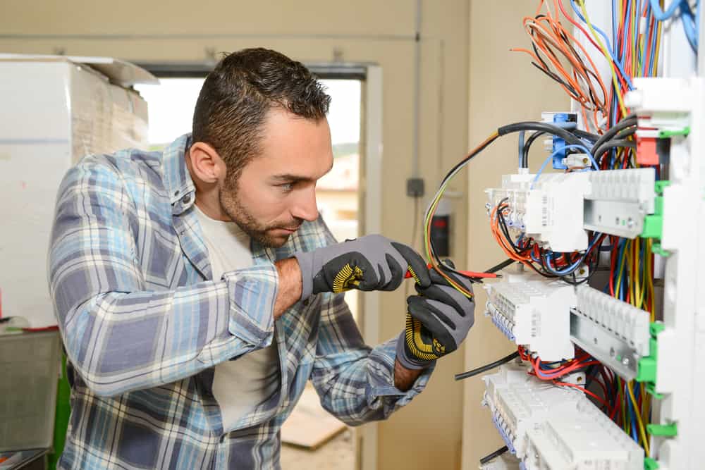 Electrician At Work At A Control panel