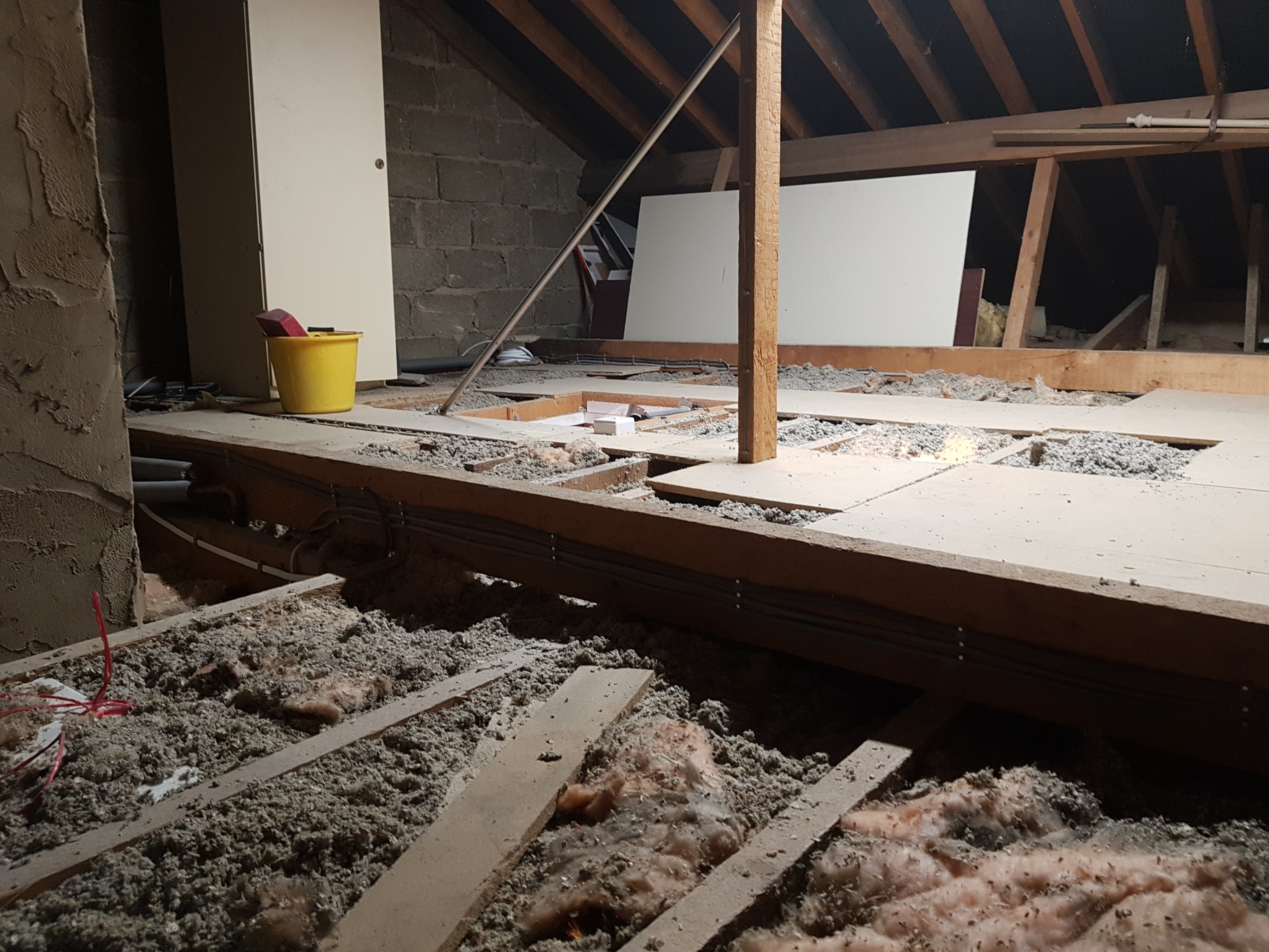 New cables clipped to boards rather than laid across joists..jpg