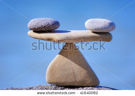 stock-photo-pair-of-scales-is-made-of-stones-on-the-cliff-41640082.jpg